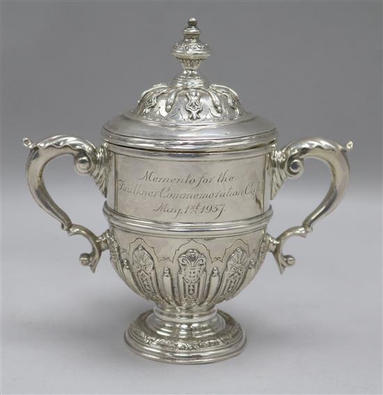 A silver Faulkner Commemoration miniature trophy cup and cover by William Comyns & Sons, London, 1936, 9 oz.